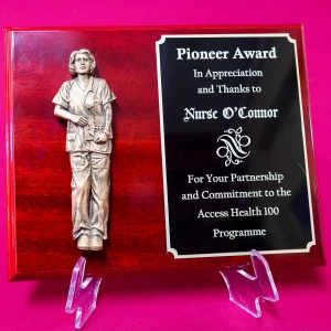 3D Nurse figure on wine red plaque 3D Nurse figure on wine red plaque